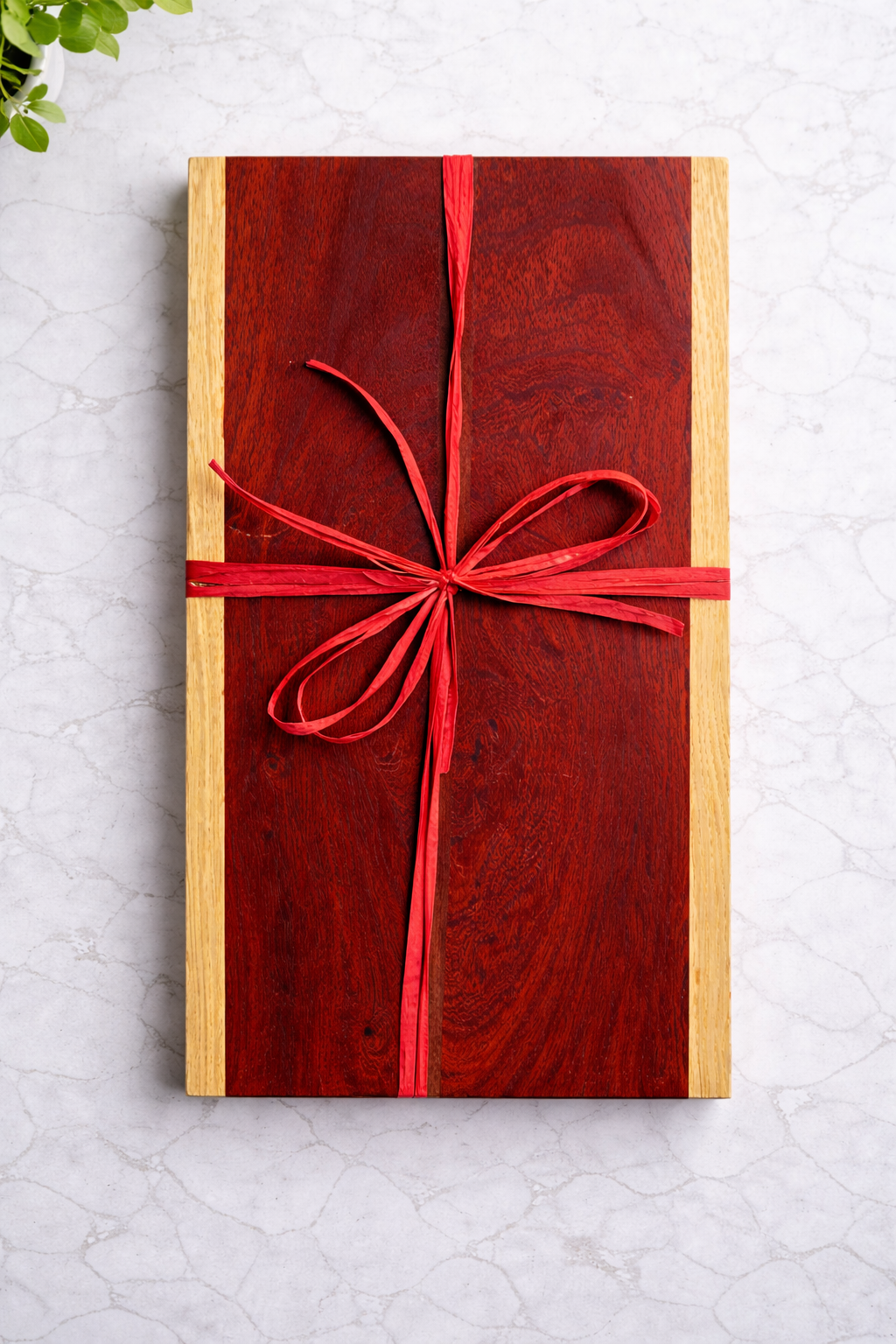 Close-up of red padauk wood grain with oak contrast
